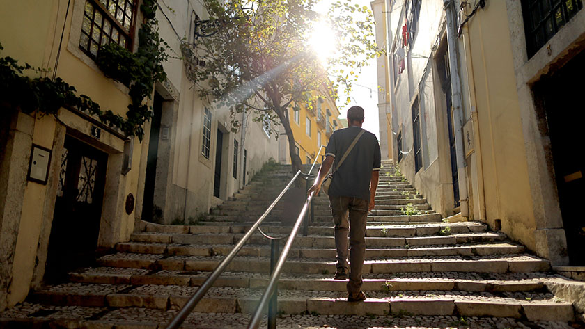 man walking up steps